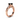 Angle view of Square black diamond set in rose gold band with carved design and small white stones on both sides.