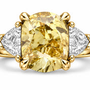 Close Up View Of 1.82 Carat Fancy Yellow Cushion Cut Three Stone Diamond Ring