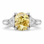 Front View Of 1.82 Carat Fancy Yellow Cushion Cut Three Stone Diamond Ring