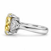 Side View Of 1.82 Carat Fancy Yellow Cushion Cut Three Stone Diamond Ring