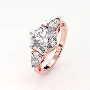 Angled View Of 3.75 Ct Three Stone Lab Diamond Ring with Pear Side Stones Lab Diamond